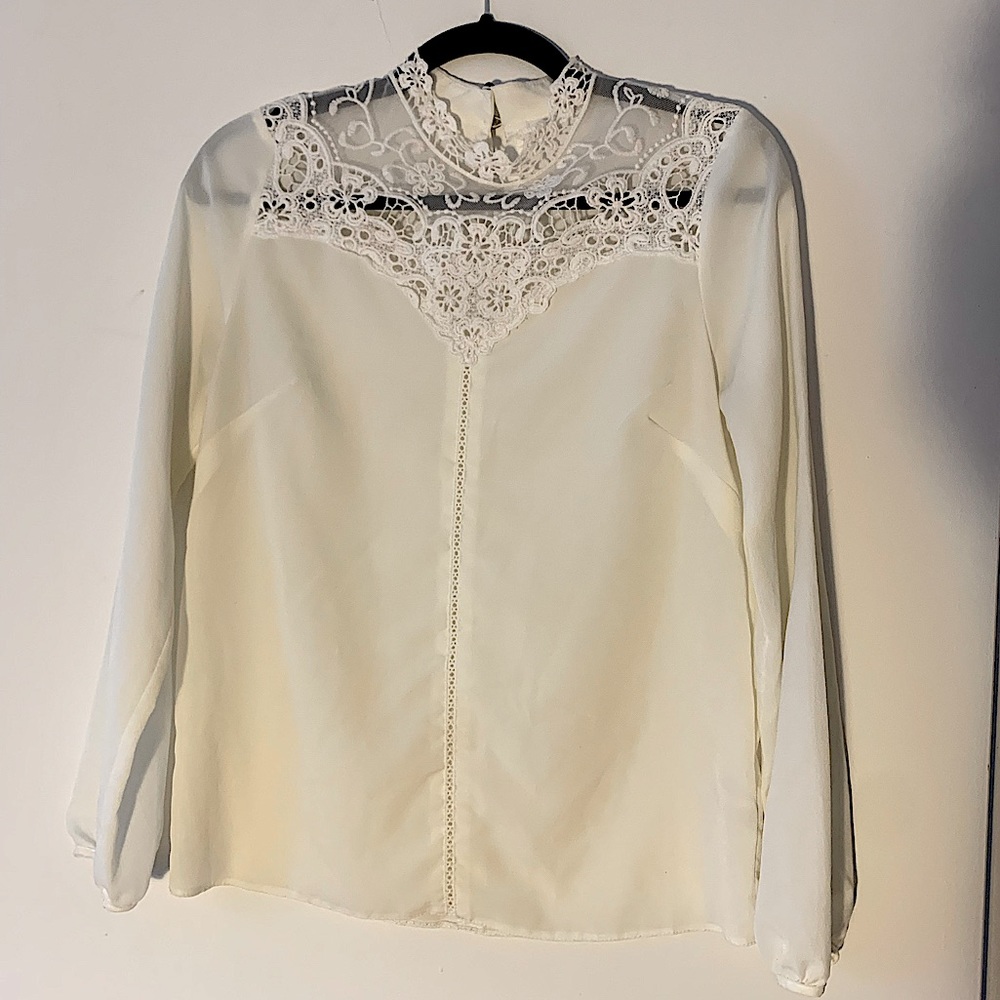 Long sleeve white blouse with crochet / lace detailing. Conservative but sexy